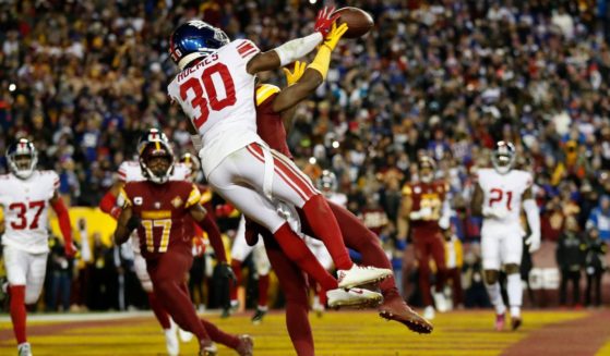 Darnay Holmes of the New York Giants breaks up a pass intended for Curtis Samuel of the Washington Commanders during the fourth quarter of the NFL Giants-Commanders game on Sunday night.