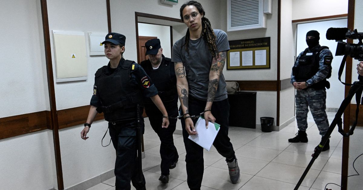WNBA basketball player Brittney Griner, who was detained at Moscow's Sheremetyevo airport and later charged with illegal possession of cannabis, leaves the courtroom after the court's verdict in Khimki outside Moscow, on August 4, 2022.