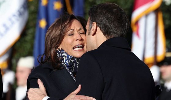 U.S. Vice President Kamala Harris is embraced by French President Emmanuel Macron during an official state visit at the White House on December 01, 2022 in Washington, DC.