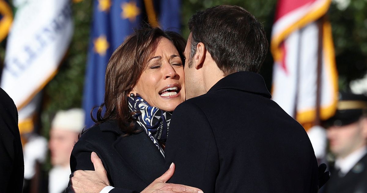 U.S. Vice President Kamala Harris is embraced by French President Emmanuel Macron during an official state visit at the White House on December 01, 2022 in Washington, DC.