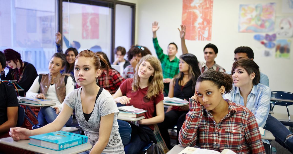 This stock photo shows a classroom full of teenage students during a lesson.