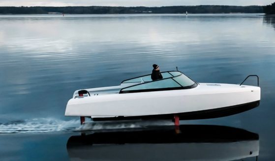 The sleek, electric watercraft appears to be flying above the water. The company plans to produce a passenger ferry version of the hydrofoil in 2023.