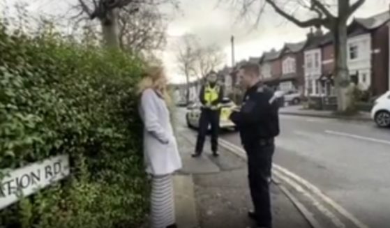Isabel Vaughan-Spruce speaks with police before being arrested for praying near an abortion clinic in Birmingham, England. (Fox News / video scr