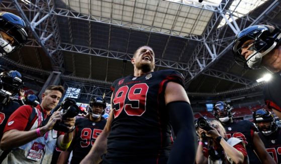 J.J. Watt of the Arizona Cardinals leads a huddle prior to a game against the New Orleans Saints at State Farm Stadium on Oct. 20 in Glendale, Arizona.