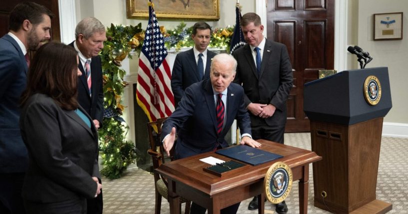 President Joe Biden gets up after signing a resolution to avert a nationwide rail shutdown in the Roosevelt Room of the White House in Washington on Friday.