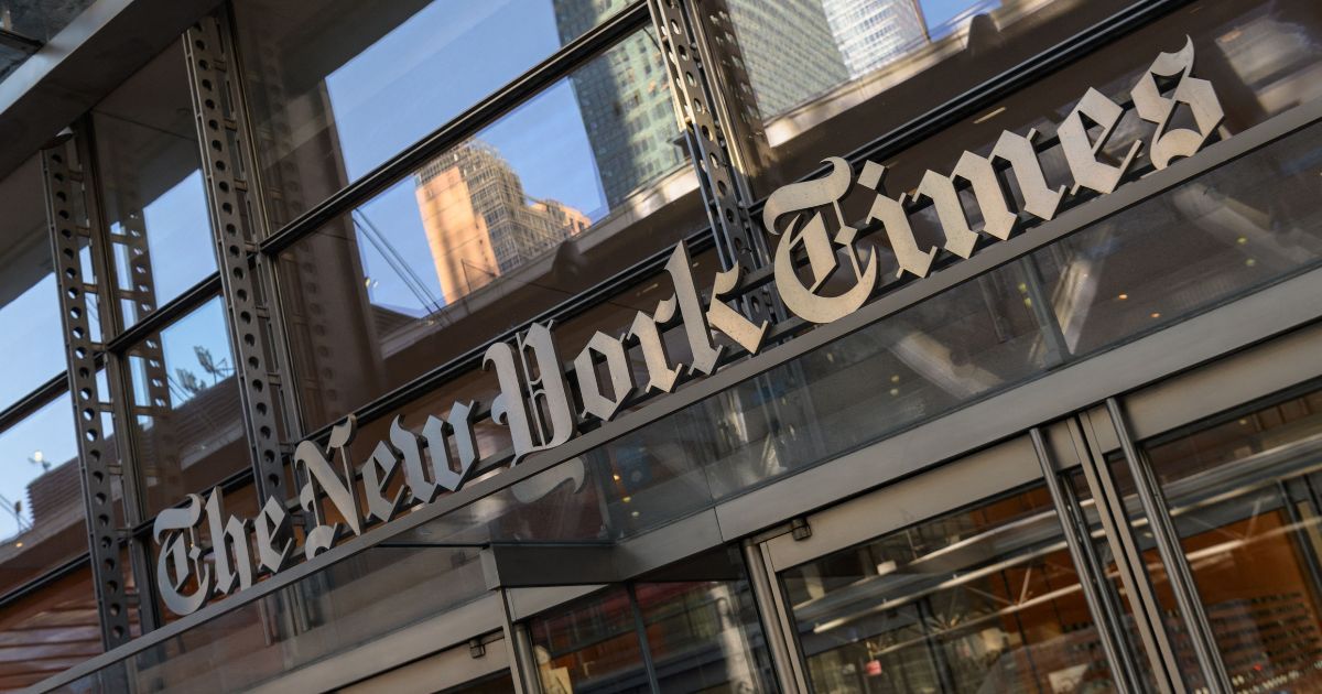 The sign for The New York Times is displayed outside the company's building in New York City on Feb. 1.