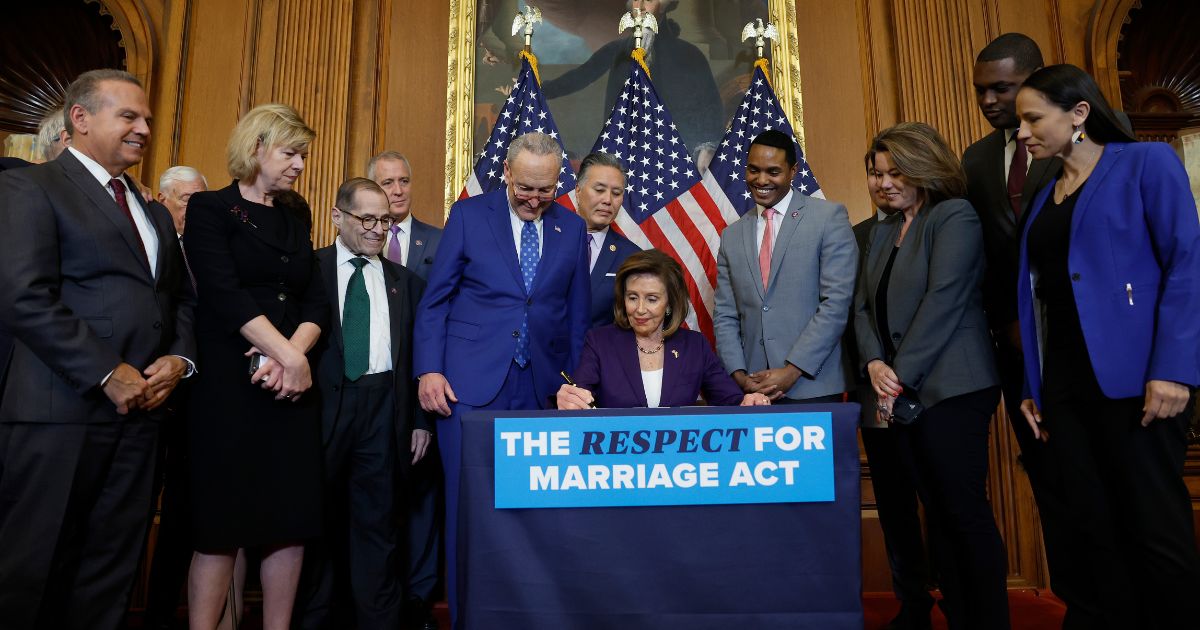 House Speaker Nancy Pelosi participates in a bill enrollment ceremony for the Respect for Marriage Act at the U.S. Capitol on Thursday.