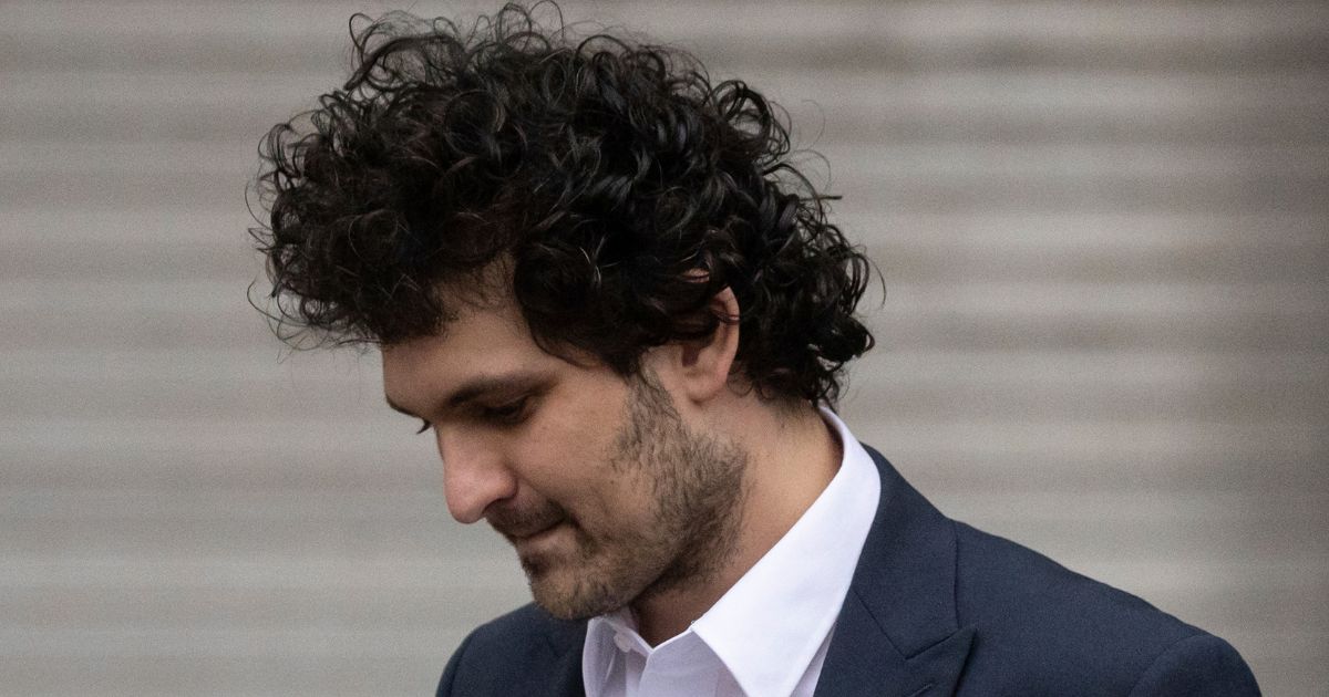 FTX founder Sam Bankman-Fried leaves a New York court following his extradition to the U.S. Thursday.
