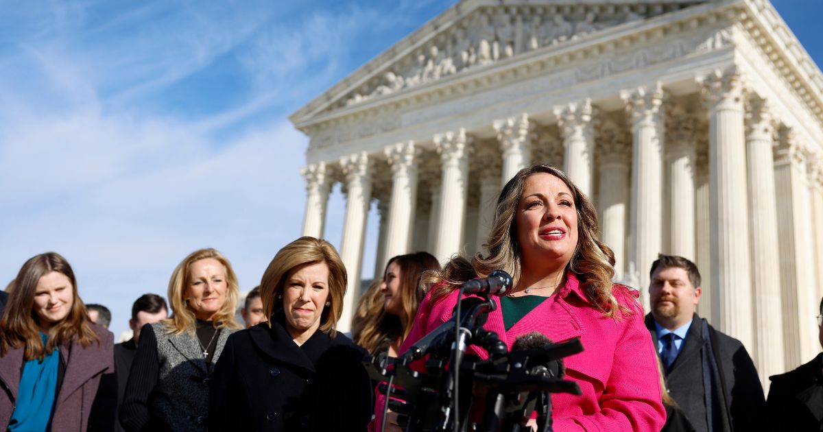 Lorie Smith speaks to reporters outside the U.S. Supreme Court on Dec. 5 in Washington, D.C.