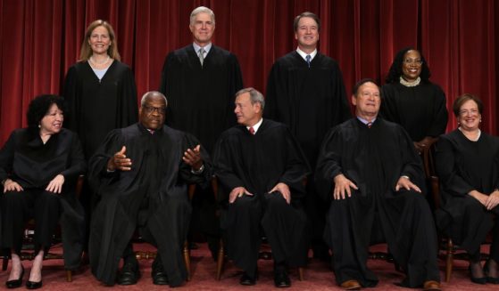 The justices of the U.S. Supreme Court -- from left, front row, Sonia Sotomayor, Clarence Thomas, John Roberts, Samuel Alito and Elena Kagan, and back row, Amy Coney Barrett, Neil Gorsuch, Brett Kavanaugh and Ketanji Brown Jackson -- pose for their official portrait in the East Conference Room of the Supreme Court building in Washington on Oct. 7.