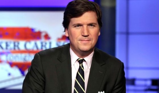 Tucker Carlson, host of "Tucker Carlson Tonight," poses for a photo in a Fox News Channel studio, in New York City.
