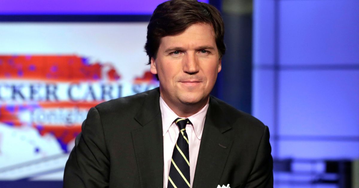 Tucker Carlson, host of "Tucker Carlson Tonight," poses for a photo in a Fox News Channel studio, in New York City.