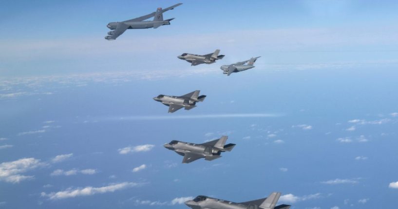 a U.S. B-52 bomber, C-17 and South Korean Air Force F-35 fighter jets flying over the Korean Peninsula during a joint air drill