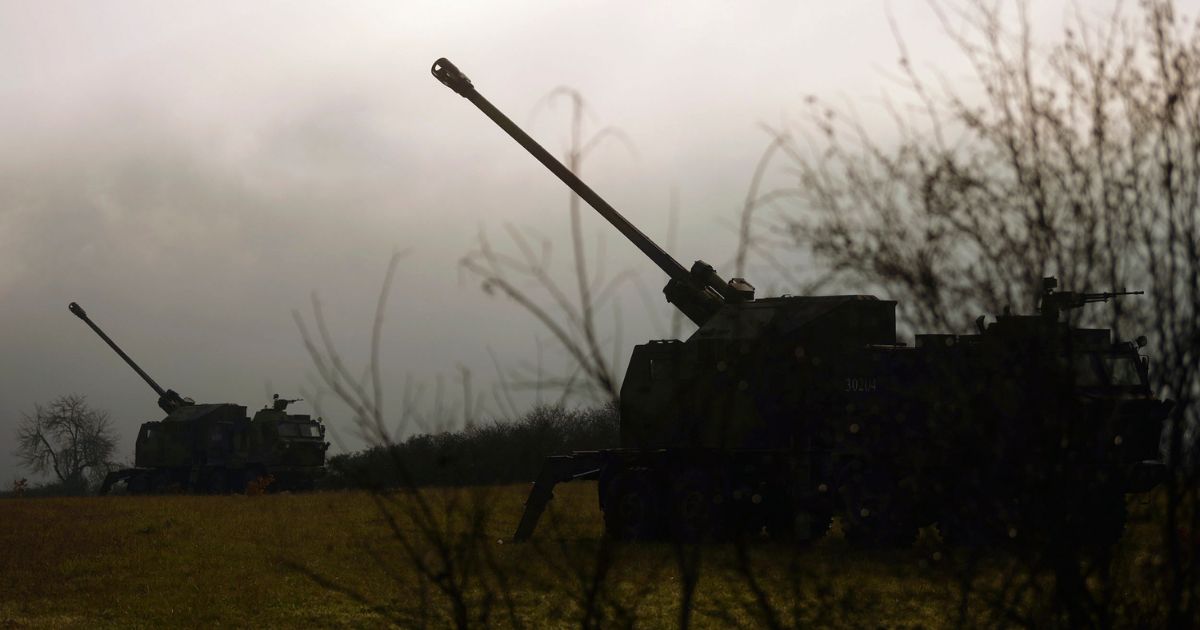 In this photo provided by the Serbian Defense Ministry Press Service, Serbian army self-propelled 155 mm gun-howitzers are seen in position near the administrative line with Kosovo, south Serbia, on Monday.