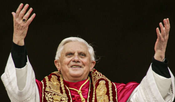 Pope Benedict XVI greets the crowd from the central balcony of St. Peter's Basilica at the Vatican on April 19, 2005, soon after his election.