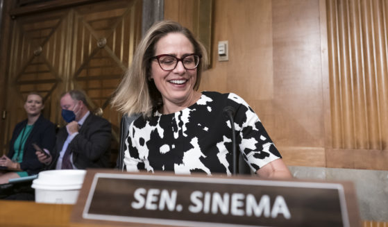 Sen. Kyrsten Sinema arrives for a meeting of the Senate Homeland Security Committee at the Capitol on Aug. 3. Sinema was a Democrat then, but she left the party on Friday.