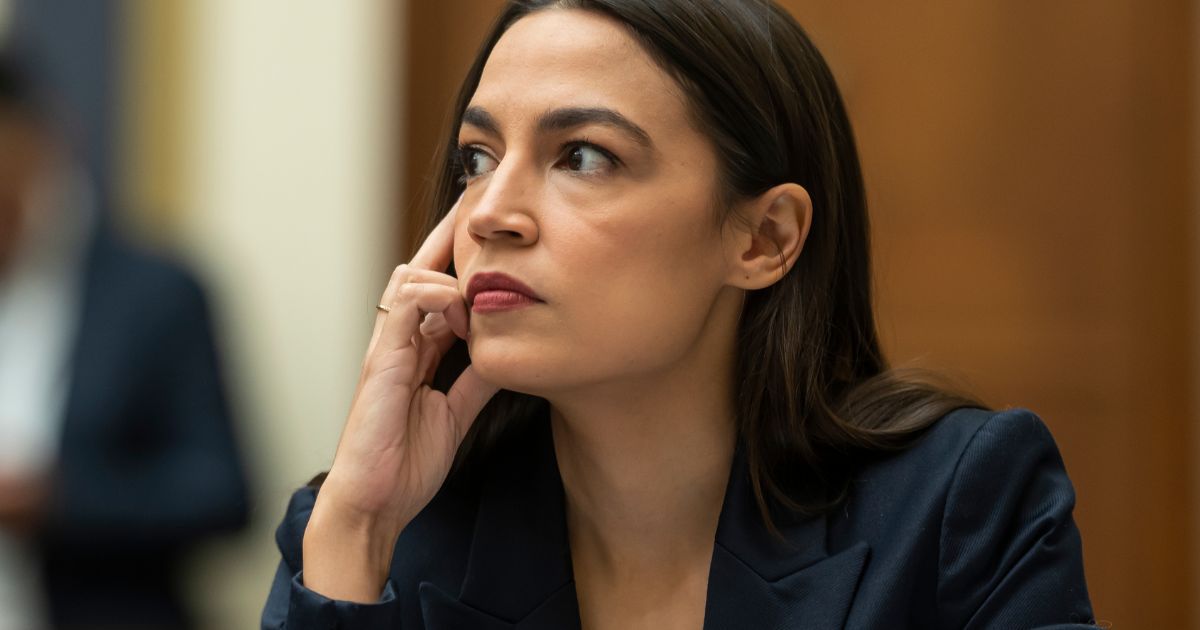 Rep. Alexandria Ocasio-Cortez listens during a House Financial Services Committee hearing at the U.S. Capitol on Tuesday in Washington, D.C.