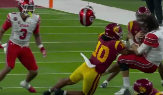 USC linebacker Ralen Goforth laid a big hit on Utah quarterback Cameron Rising in the Pac-12 championship game on Friday.