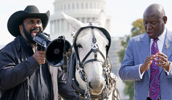 John Wesley Boyd Jr., left, founder, and president of the National Black Farmer's Association, speaks during a news conference near Capitol Hill in October to announce a class-action lawsuit against the federal government. With Boyd is attorney Benjamin Crump, right. 