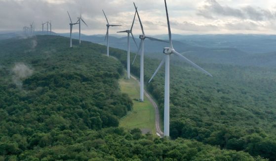 In this aerial view, turbines that are part of Constellation Energy's Criterion Wind Project stand in a row along the top of Backbone Mountain on Aug. 22 in Oakland, Maryland.