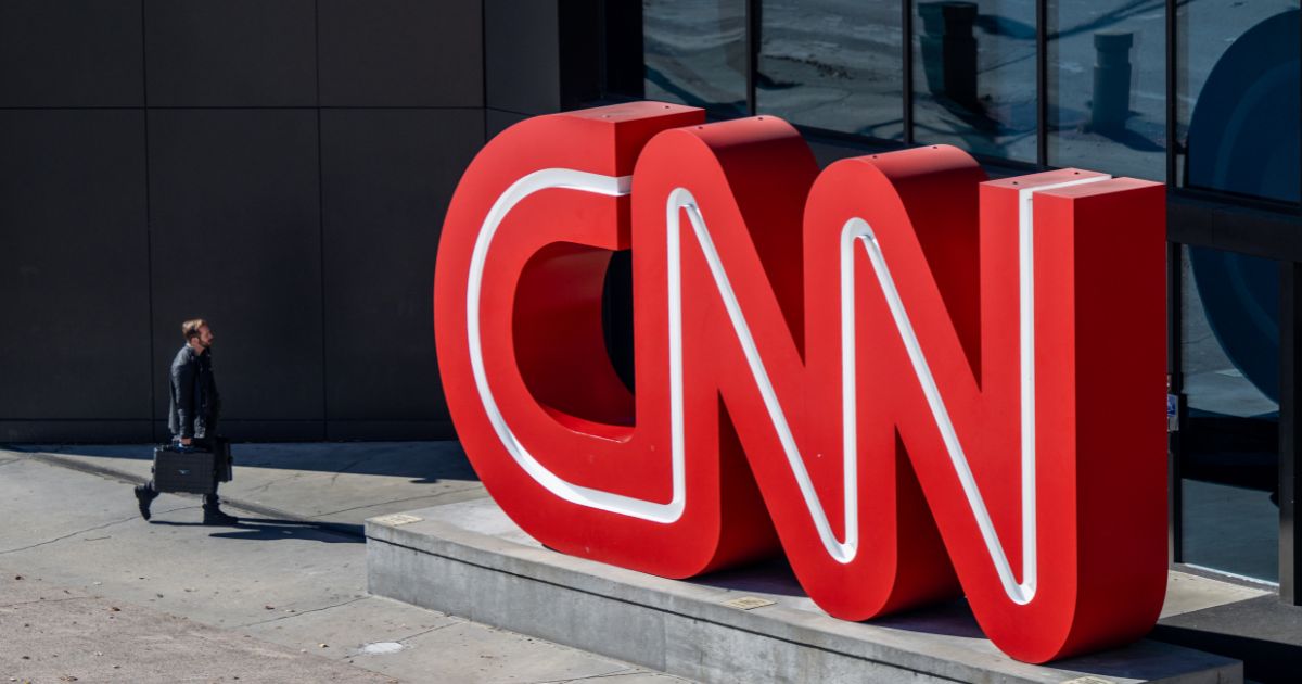 A person walks into the world headquarters for the Cable News Network (CNN) on Nov. 17 in Atlanta.