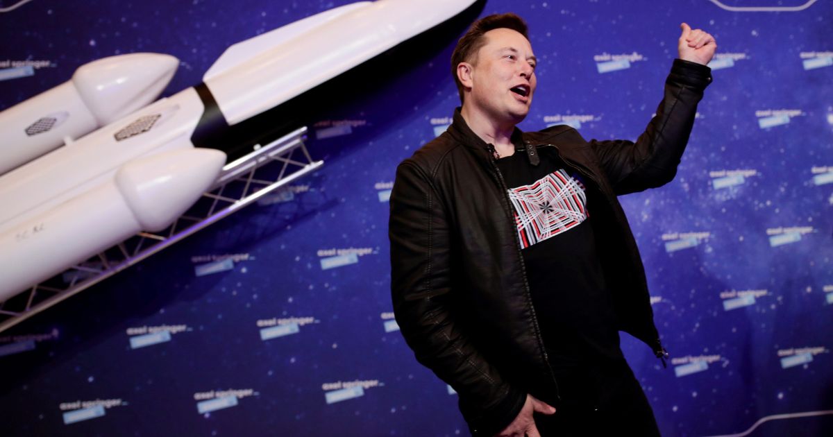SpaceX owner and Tesla CEO Elon Musk arrives on the red carpet for the Axel Springer media award, in Berlin on Dec. 1, 2020.