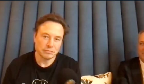 Elon Musk is seen on a podcast on Saturday.