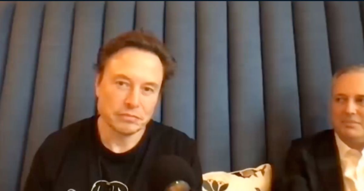 Elon Musk is seen on a podcast on Saturday.