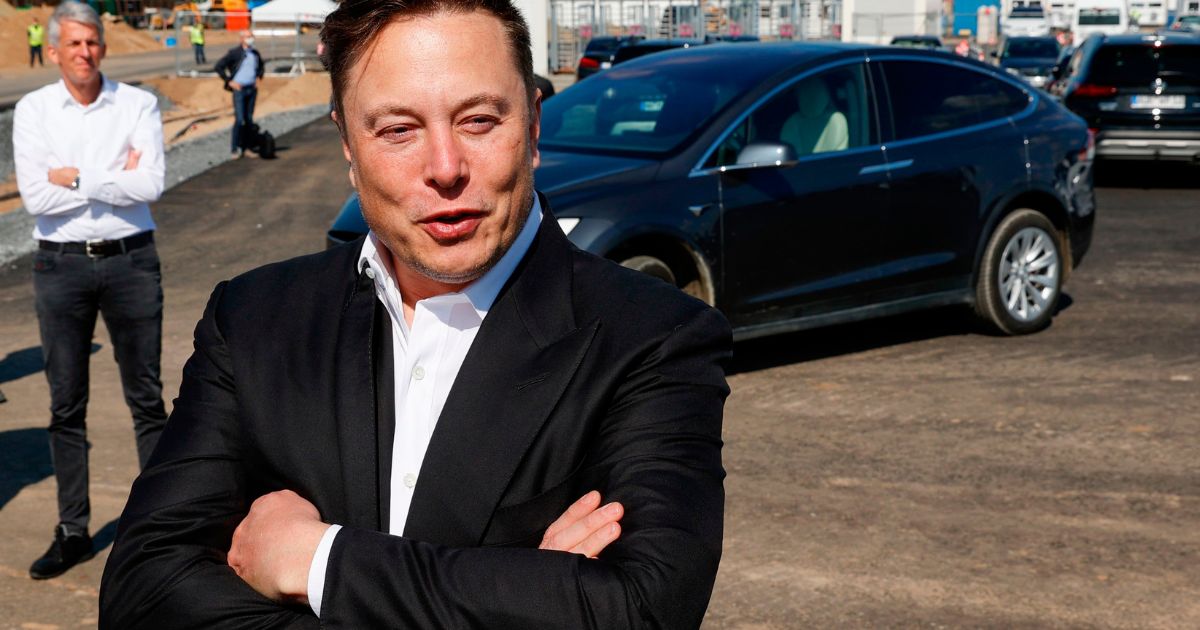 Tesla CEO Elon Musk talks to media as he arrives to visit the construction site of the future US electric car giant Tesla, on Sept. 3, 2020, in Gruenheide near Berlin.