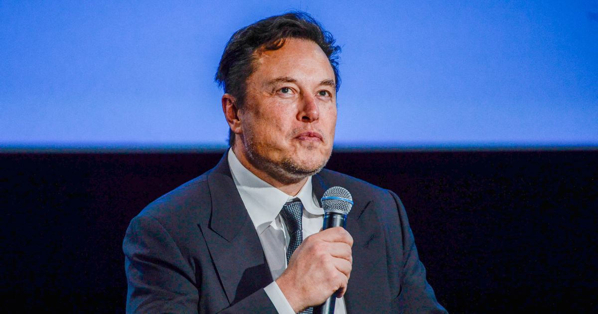 Tesla CEO Elon Musk looks up as he addresses guests at the Offshore Northern Seas 2022 (ONS) meeting in Stavanger, Norway, on Aug. 29.
