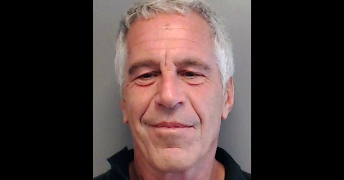 In this handout provided by the Florida Department of Law Enforcement, Jeffrey Epstein poses for a sex offender mugshot after being charged with procuring a minor for prostitution on July 25, 2013, in Florida.