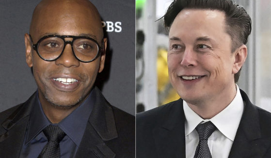 Comedian Dave Chappelle, left, invited Twitter owner Elon Musk, right, onto the stage during his Sunday night comedy show, receiving mixed reactions from the audience.