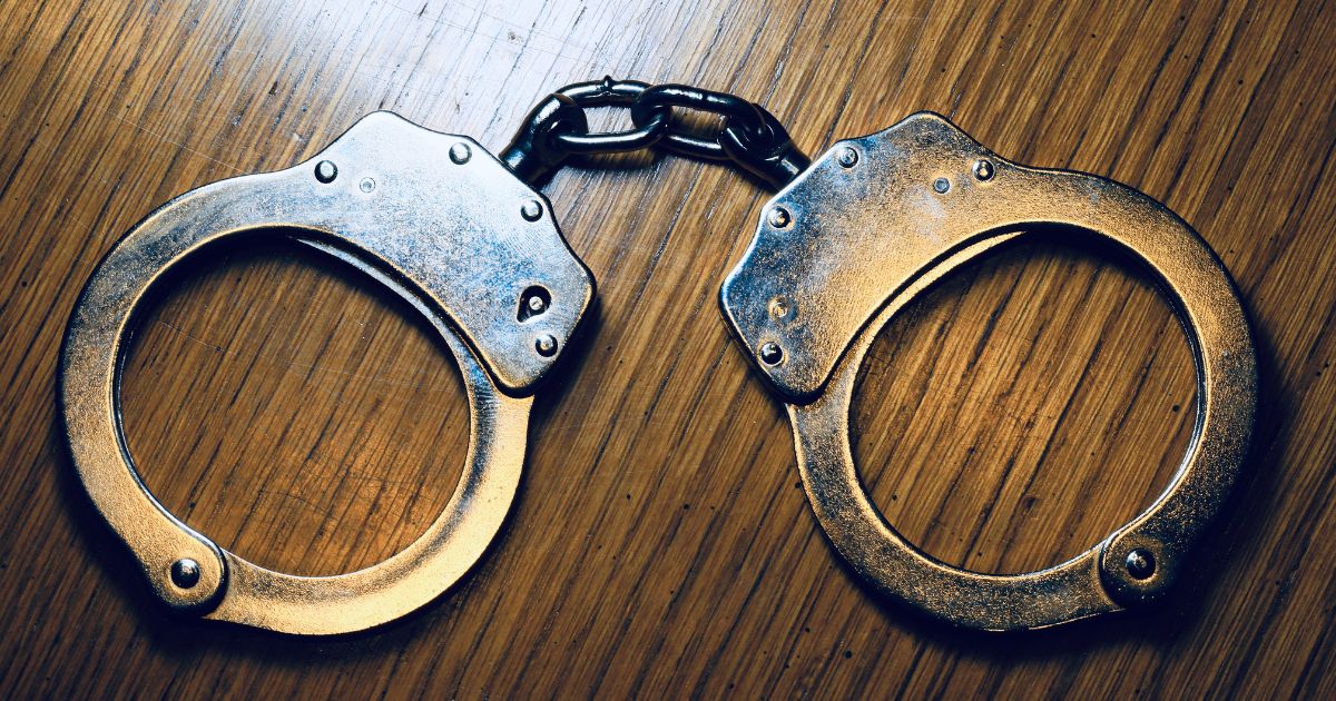 A pair of handcuffs is seen in the above stock image.