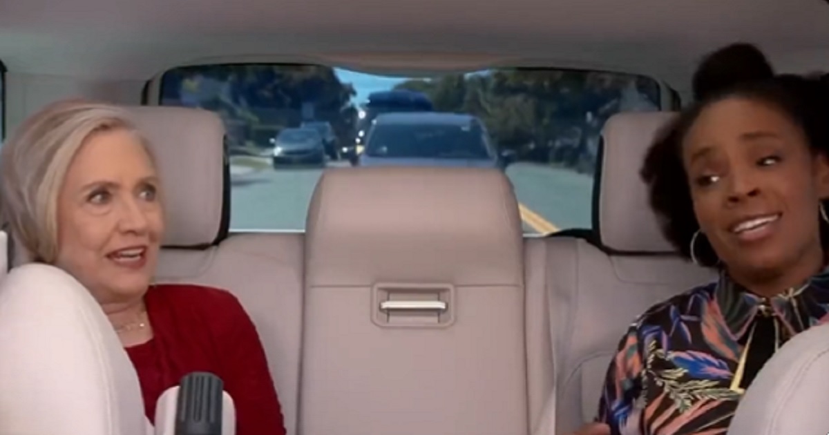 Hillary Clinton and comedian Amber Ruffin sing along to "I Will Survive" in the back seat of a car.