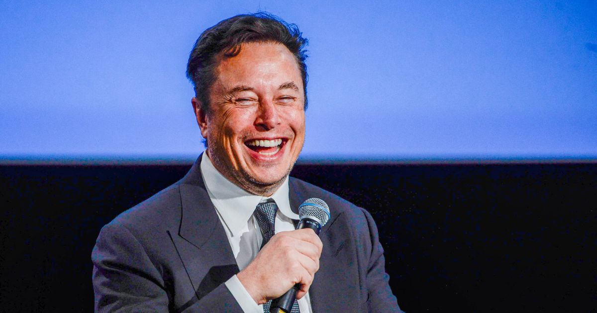 Tesla CEO Elon Musk smiles as he addresses guests at the Offshore Northern Seas 2022 (ONS) meeting in Stavanger, Norway, on Aug. 29.