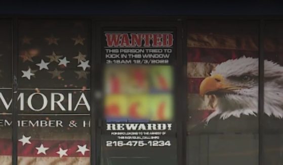 A store owner posted a wanted sign to try to find the individual who broke in.