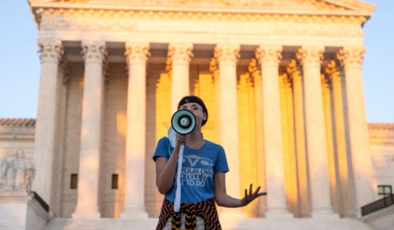 A pro-abortion activist speaks outside the Supreme Court on Sept. 2, 2021, in Washington, D.C.