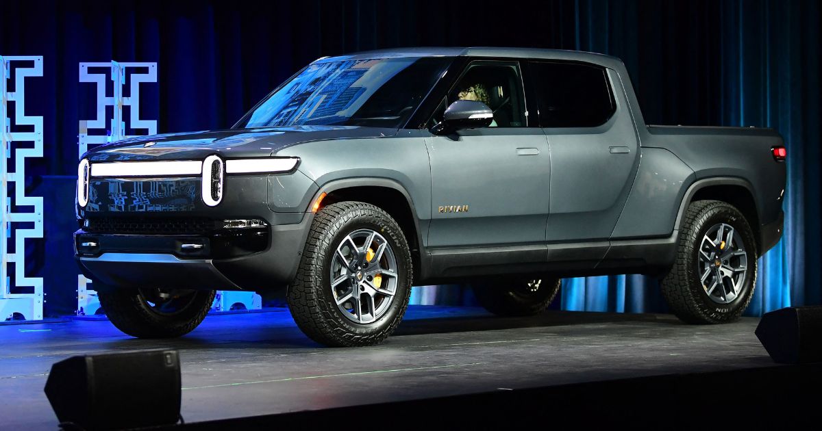 The Rivian R1T arrives on stage as a 2022 Truck of the Year Finalist at the LA Auto Show in Los Angeles, California on November 17, 2021.