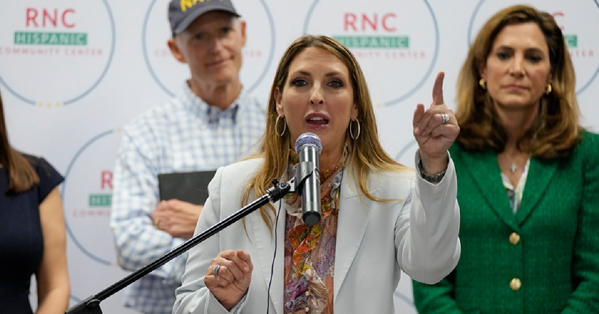 Republican National Committee chairman Ronna McDaniel speaks at an October rally in Doral Florida. Behind her are Florida Gov. Rick Scott and Rep. Maria Elvira Salazar.