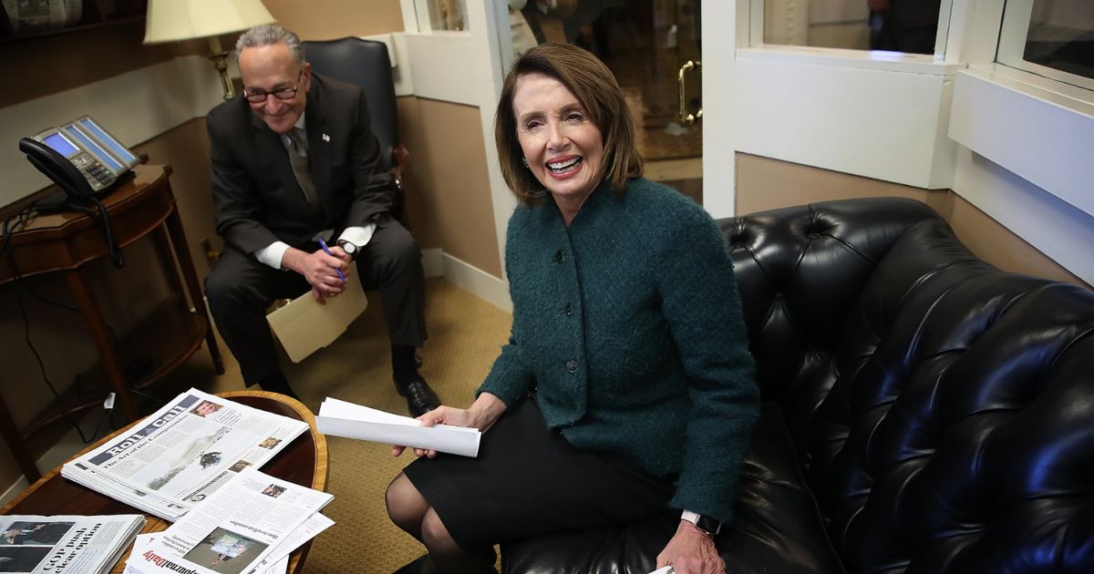 U.S. House Minority Leader Nancy Pelosi (D-CA) and Senate Minority Leader Chuck Schumer (D-NY) and meet prior to a news conference at the U.S. Capitol on March 22, 2018, in Washington, D.C.