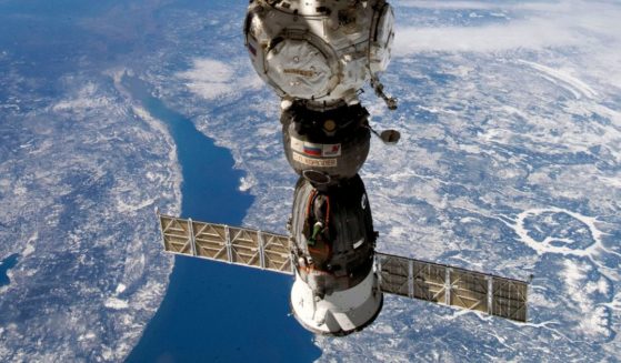 This undated handout photo taken by Russian cosmonaut Sergei Korsakov and released by Roscosmos State Space Corporation shows a Soyuz capsule of the International Space Station (ISS) during its fly.