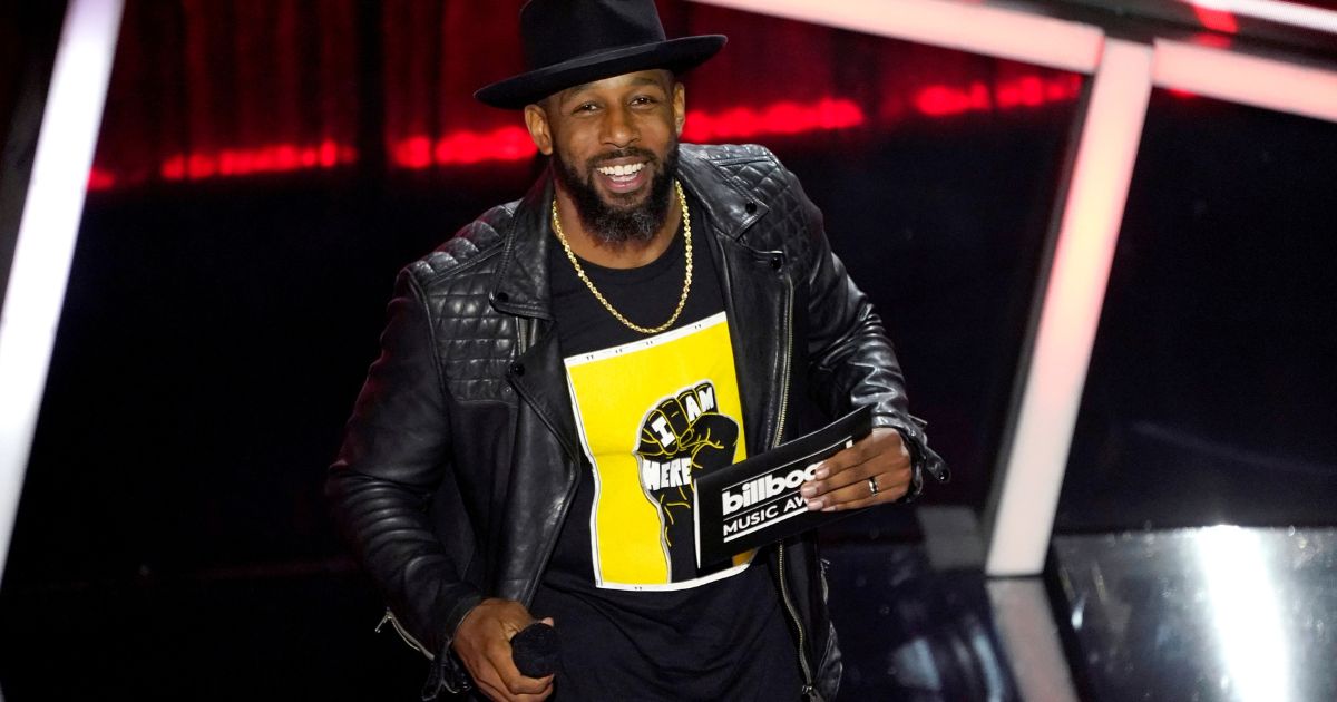Stephen "tWitch" Boss presents the award for top Latin artist at the Billboard Music Awards in Los Angeles on Oct. 14, 2020.