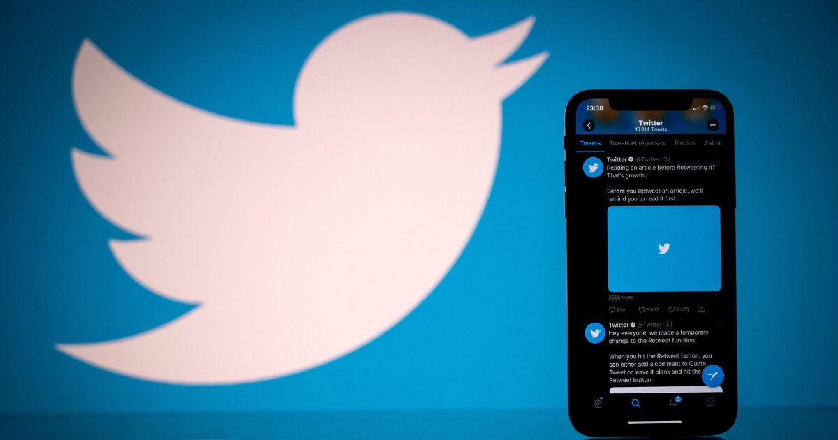This photograph taken on Oct. 26, 2020, shows the logo of U.S. social network Twitter displayed on the screen of a smartphone.