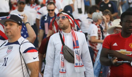United States rally near Khalifa International Stadium before heading in to watch the match before a FIFA World Cup Qatar 2022 Round of 16 match between Netherlands and USMNT at Khalifa International Stadium on December 3, 2022 in Doha, Qatar
