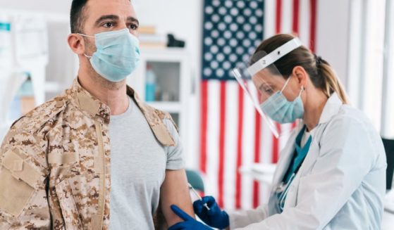 The above stock image is of a soldier receiving a vaccine.