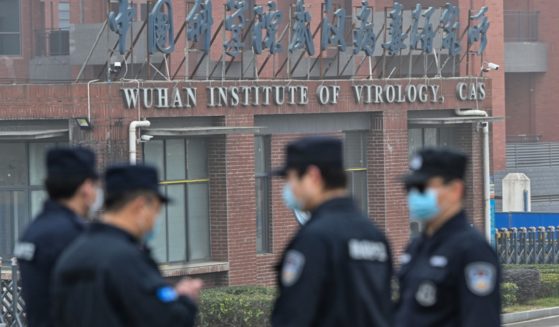 Security personnel stand guard outside the Wuhan Institute of Virology in Wuhan, China, in a February 2021 file photo.