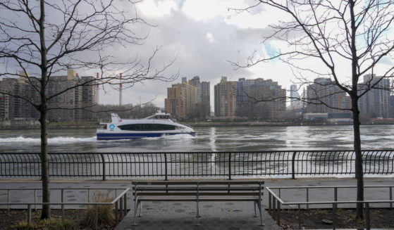 A commuter ferry travels down the East River on the Upper East Side of the Manhattan borough of New York City on Jan. 6. Woolly mammoth bones allegedly were dumped in the river in the 1940s.