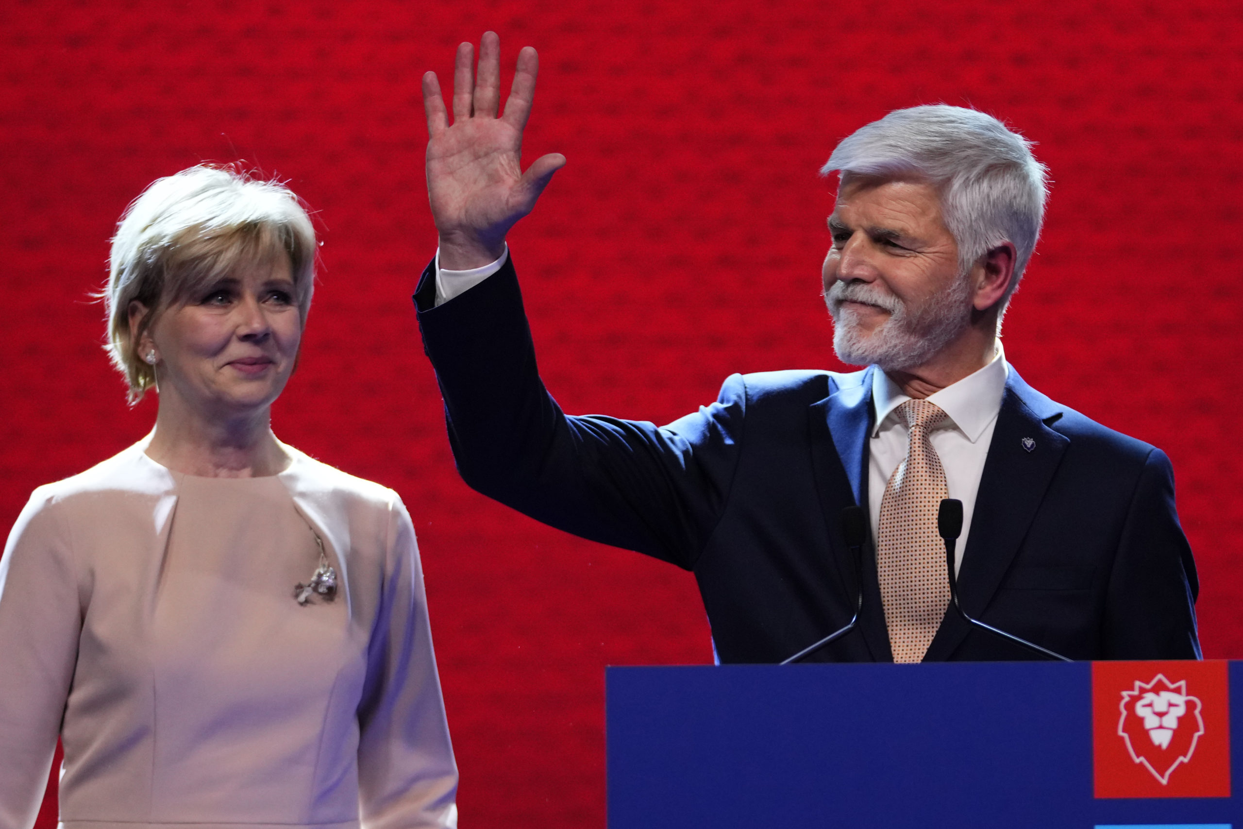 Czech Republic President-elect Petr Pavel, with his wife, Eva, greets supporters in Prague on Saturday after the announcement of the results in the presidential runoff.