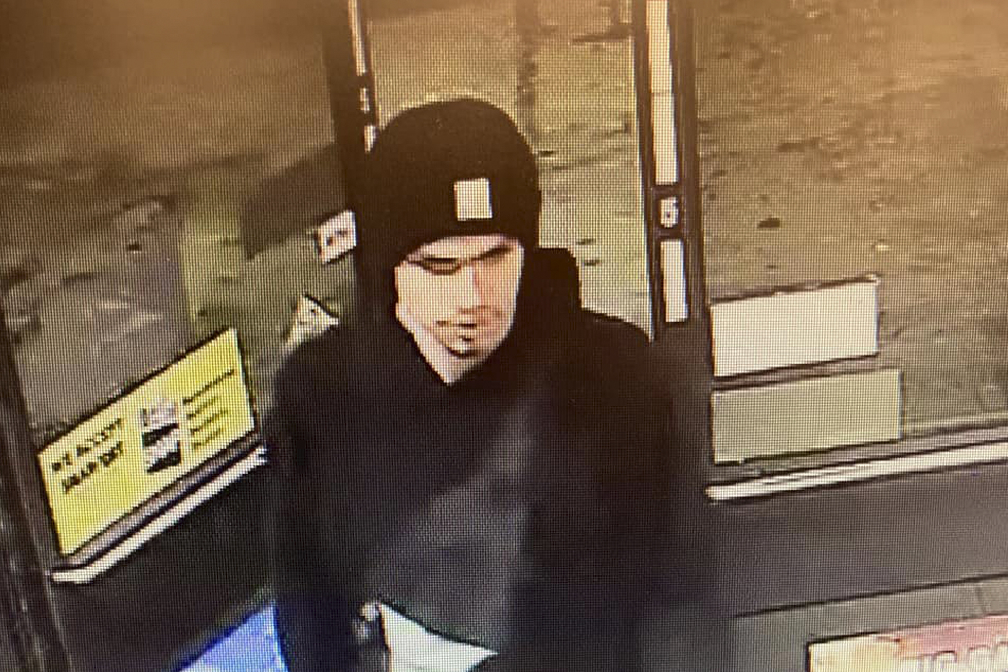 A suspect sought in a shooting at a convenience store in Yakima, Washington, is seen on surveillance footage early on Tuesday.