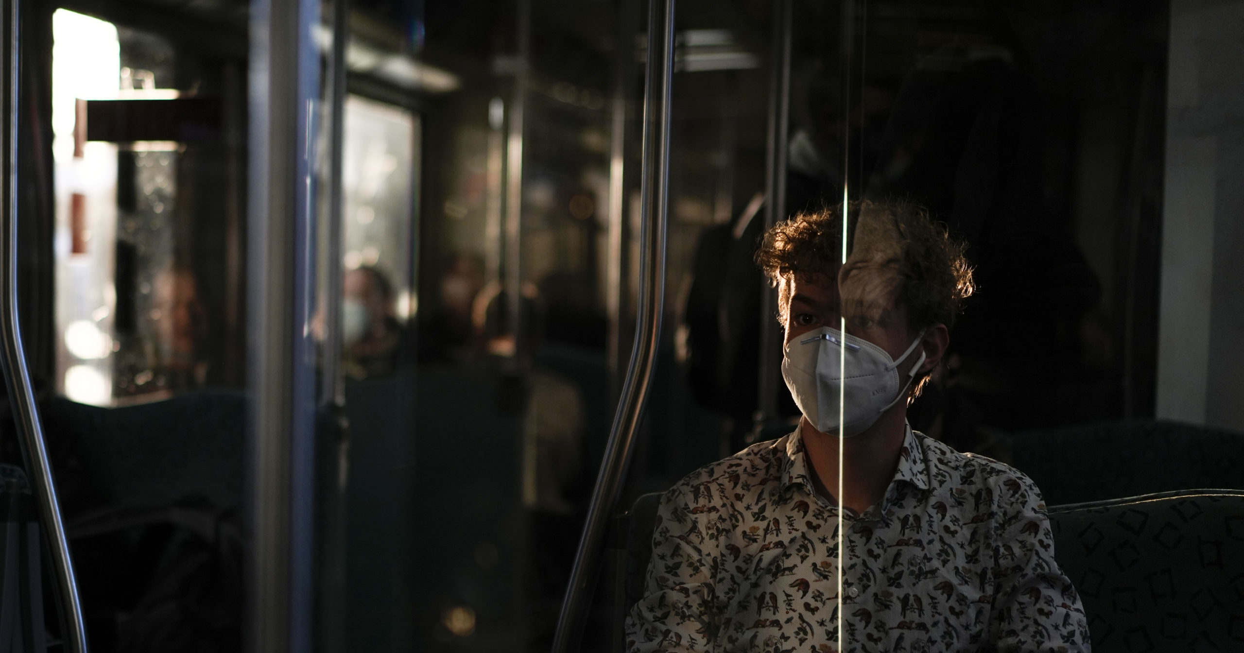 A man wearing a mask travels on a train in Berlin on March 22, 2022.